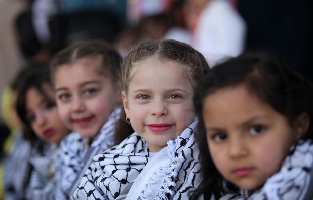 Palestinian children take part in a celebration to mark the Children's Day